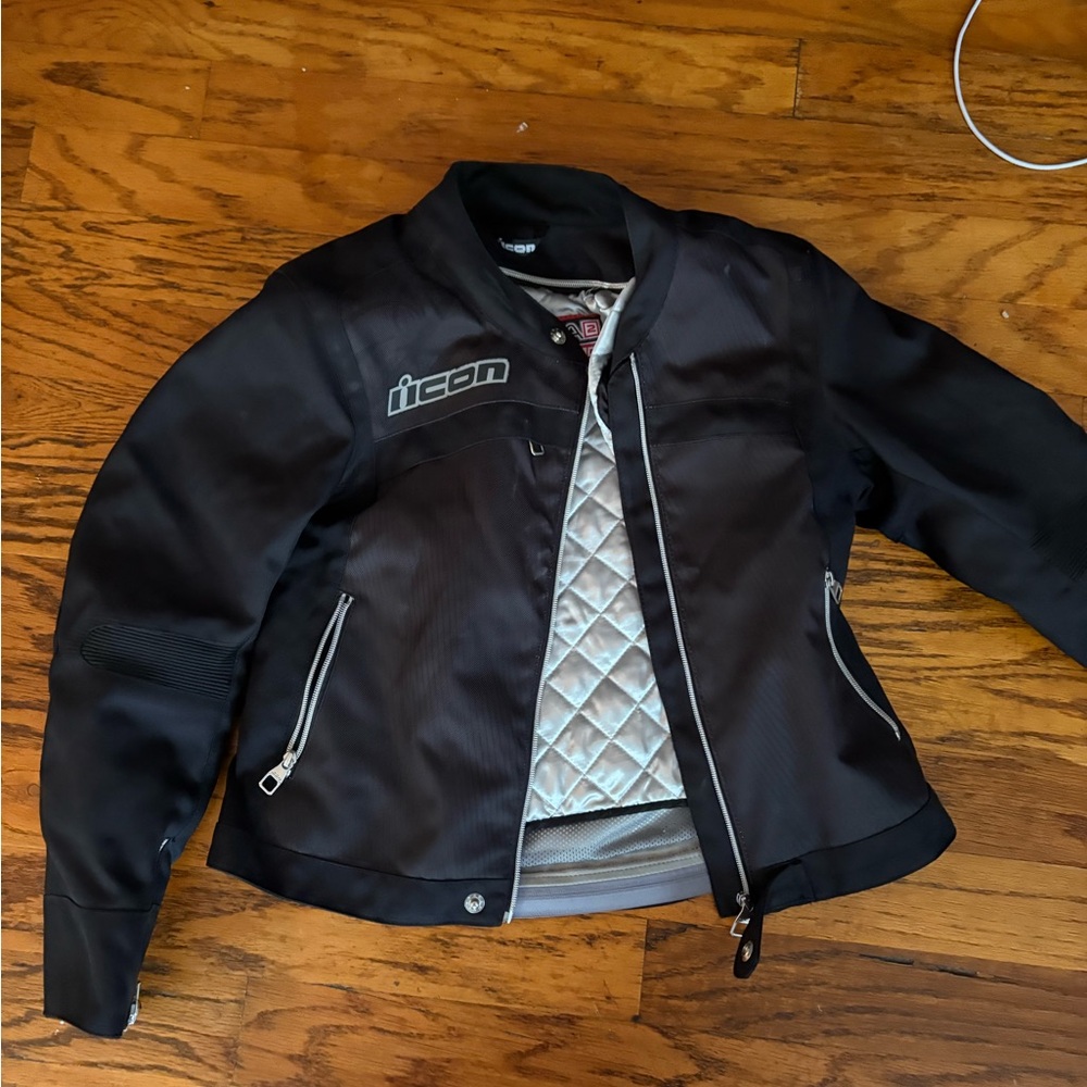 ICON Black Women's Motorcycle Jacket with Silver Quilted Lining
